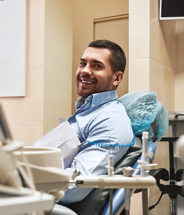 smiling patient in dental chair